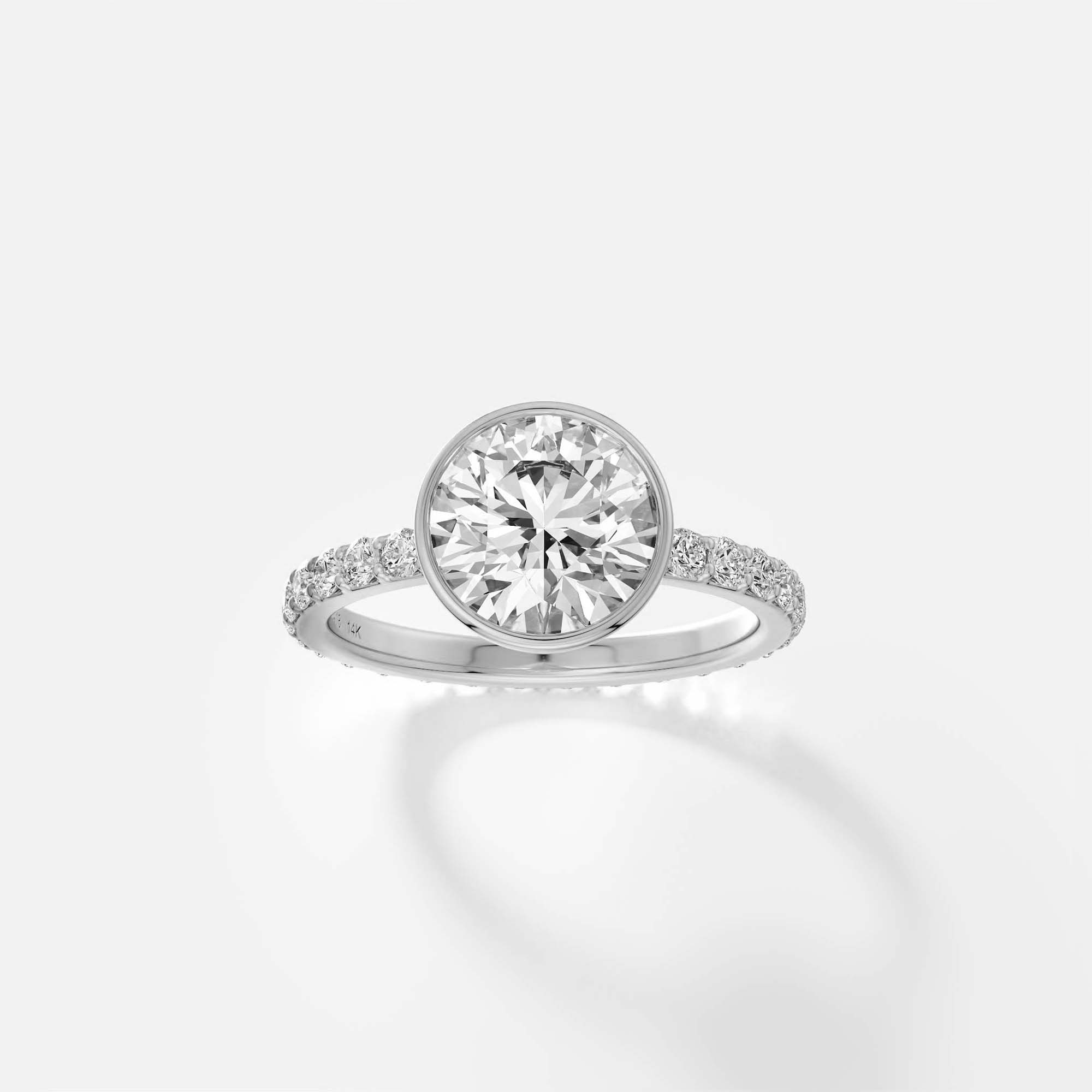 Tulpe bezel diamond pavé band engagement ring front view in platinum