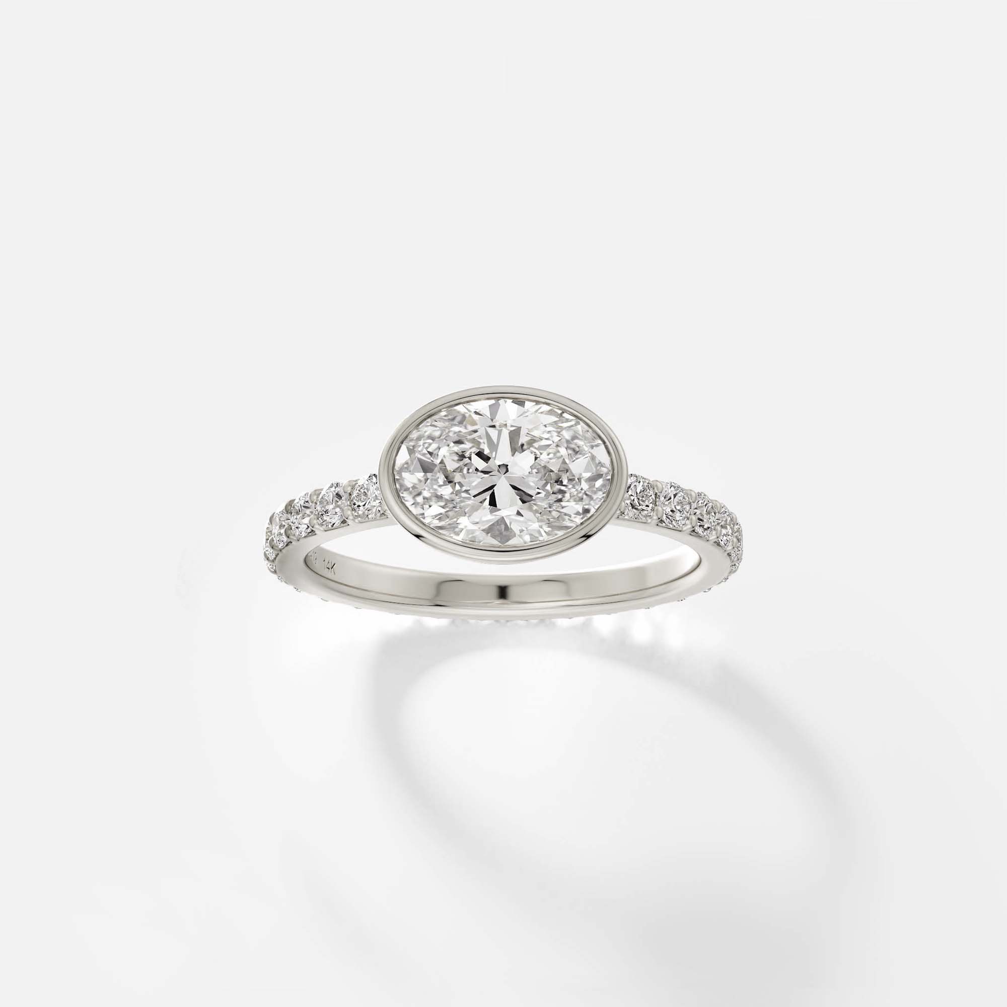 Tulpe oval diamond bezel pavé engagement ring front view in 14k white gold