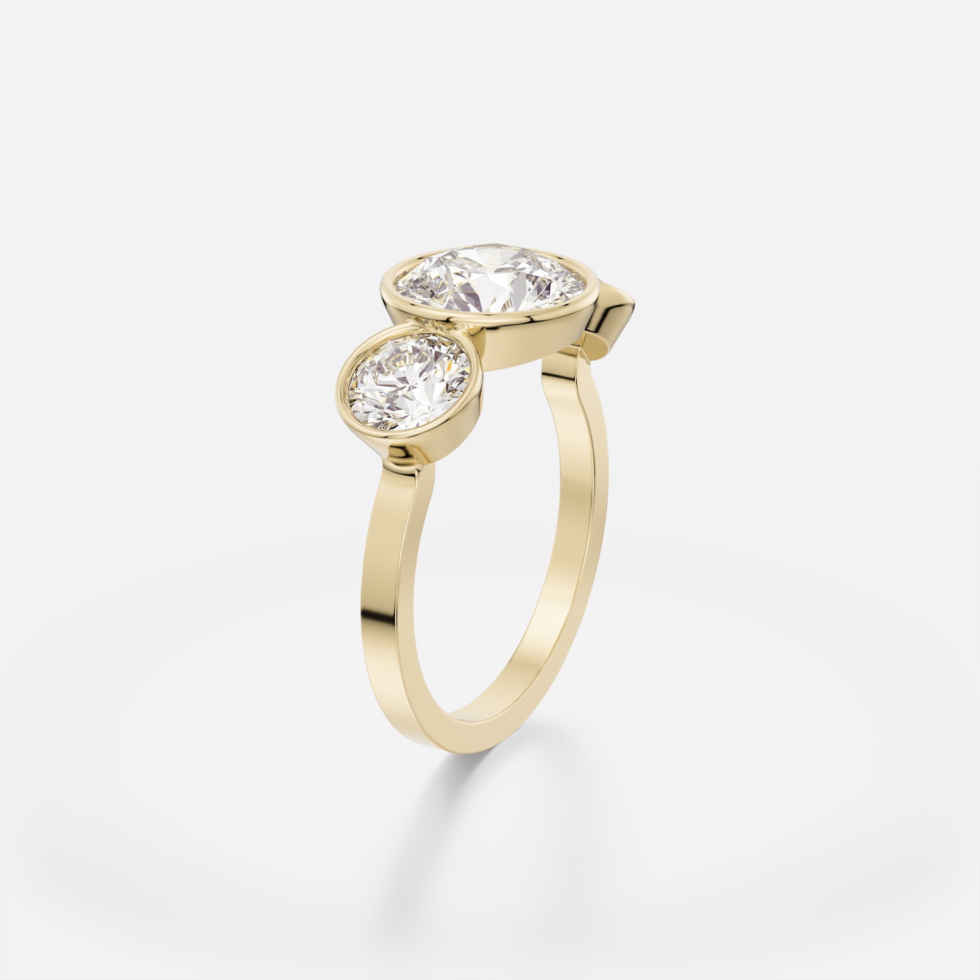 Modern cluster engagement ring with large center diamond and two side stones in open setting on flat band