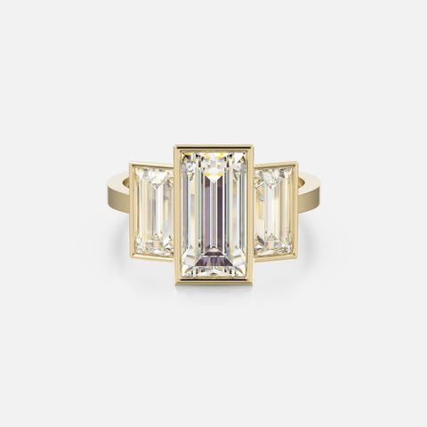 14k yellow gold three stone engagement ring with 3 carat baguette-cut center diamond and two 1 carat baguette side stones on flat band