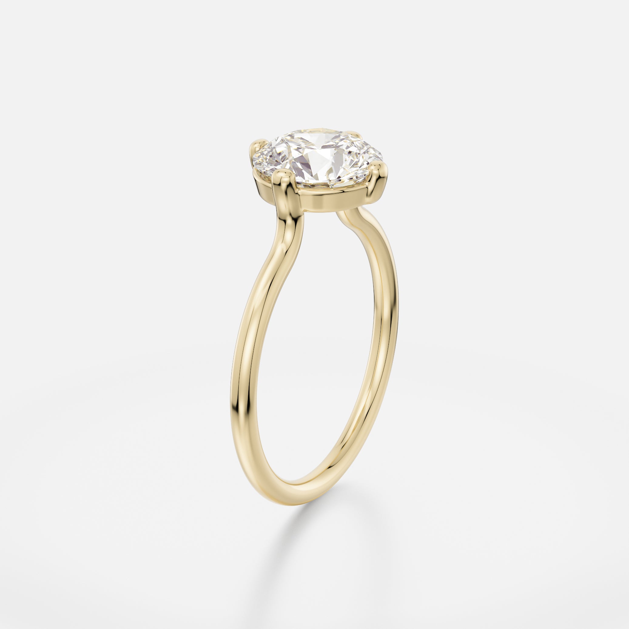 Thin round profile band engagement ring with 2 ct round brilliant-cut diamond in compass prong setting