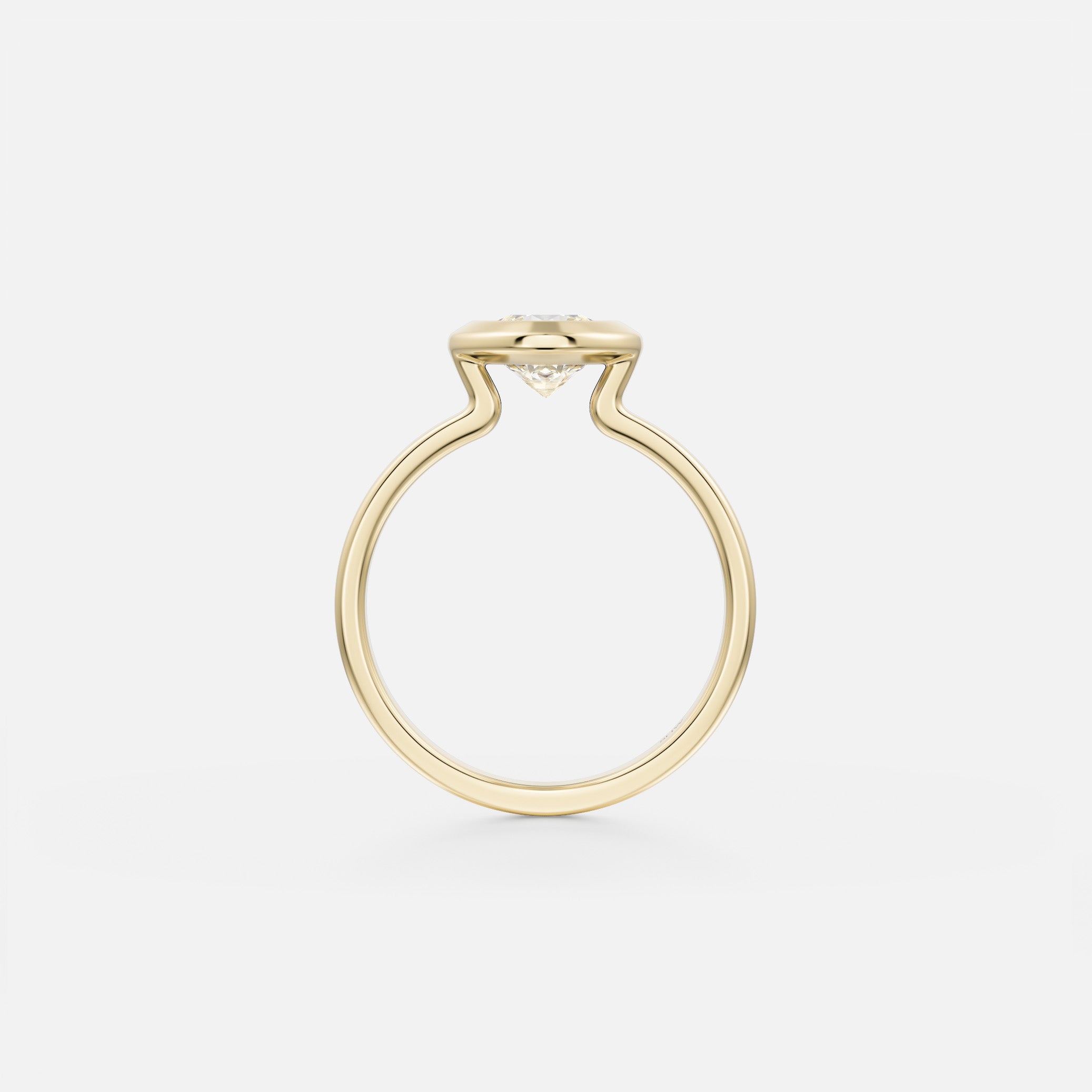14 karat yellow gold sculptural engagement ring with thick bezel set round diamond