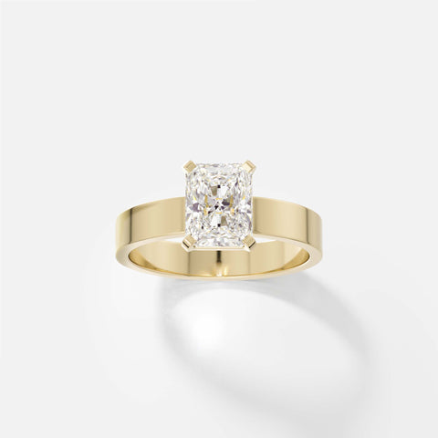 14k yellow gold engagement ring with 1.50 carat radiant-cut diamond set north south in corner prongs on flat profile band