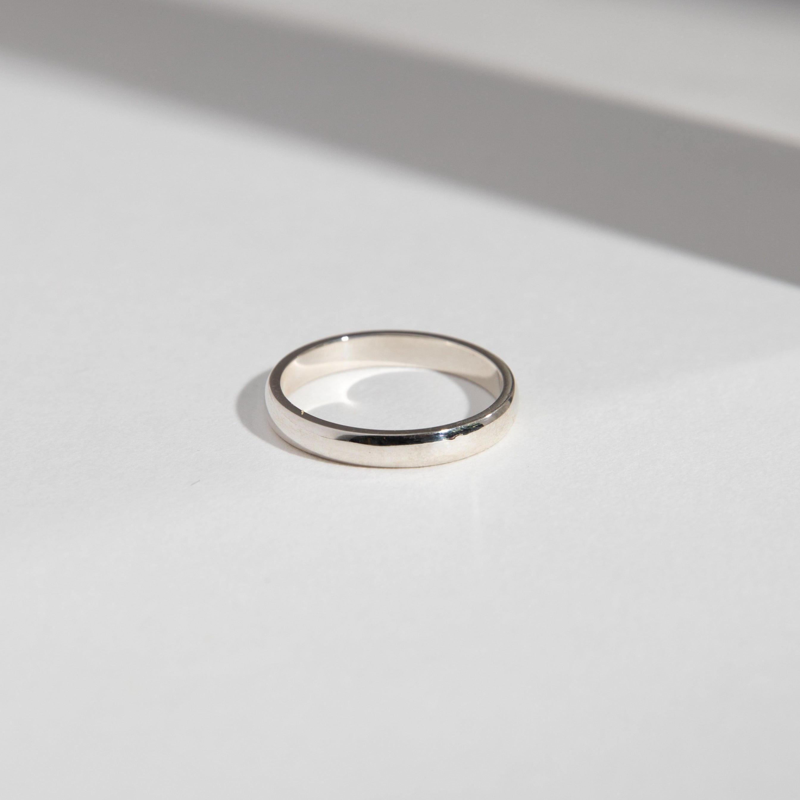 14k white gold 3mm domed wedding band with smooth rounded profile