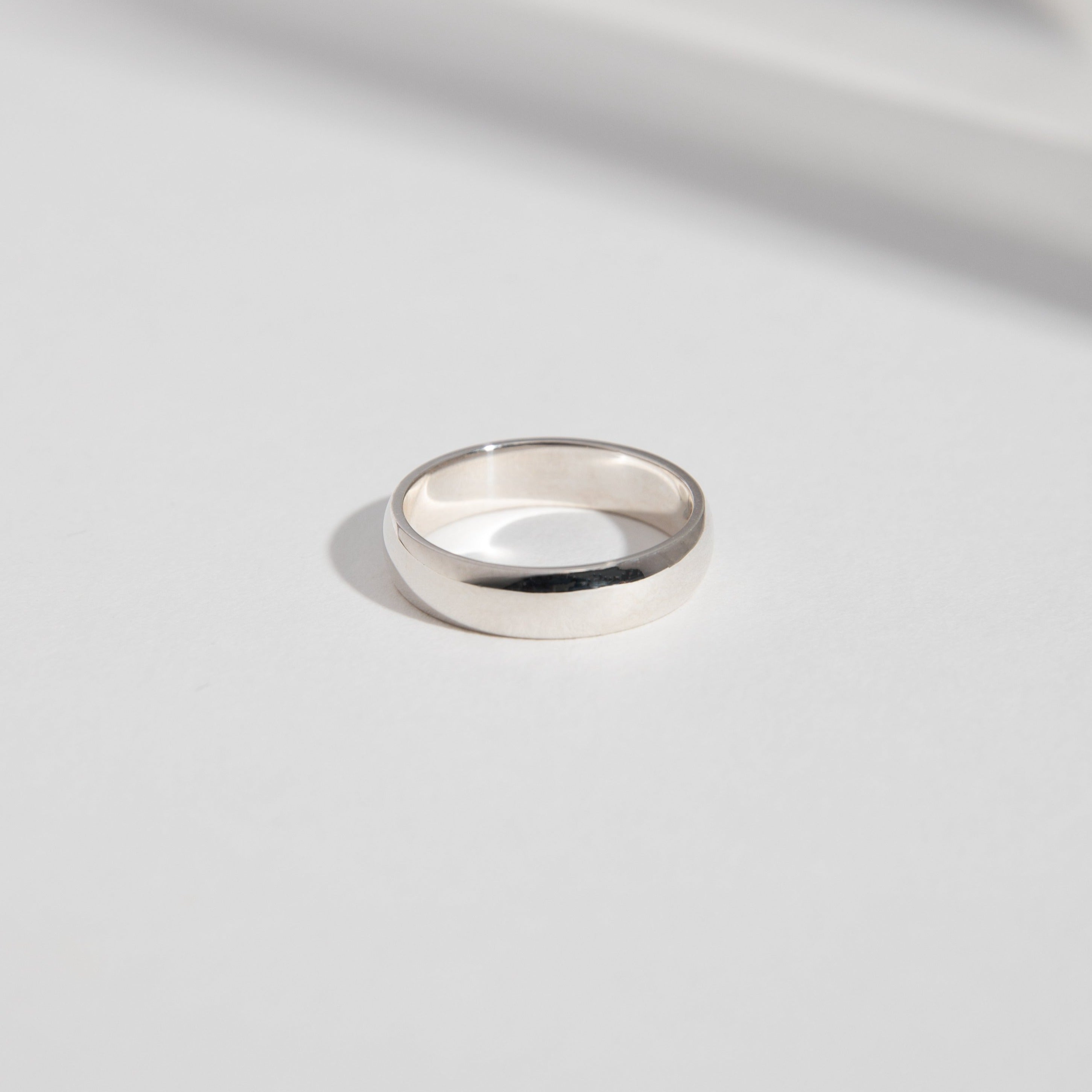 14k white gold 5mm domed wedding band with smooth rounded profile