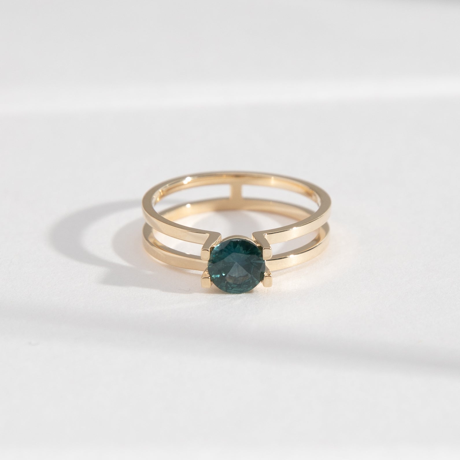 Cara Unique Ring in 14k Gold set with a 0.68ct dark teal round brilliant cut sapphire By SHW Fine Jewelry New York City