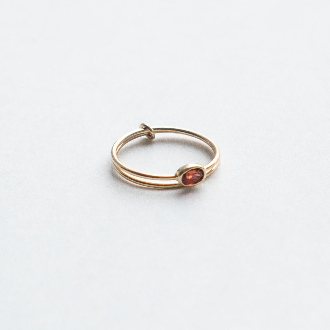 Dana Unique Ring in 14k Gold set with a 0.3ct garnet by SHW Fine Jewelry