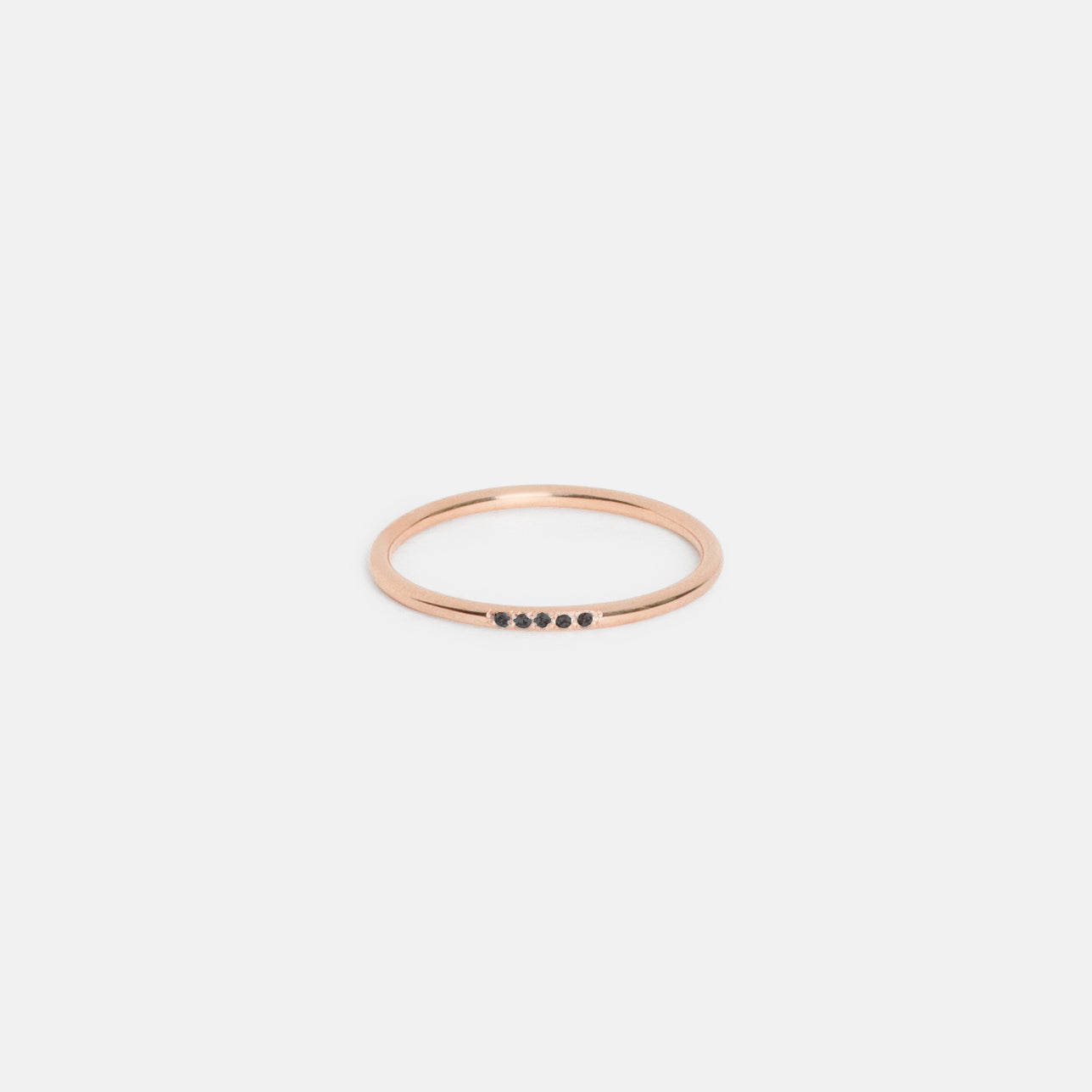 14k rose gold delicate wedding band with five black pavé diamonds