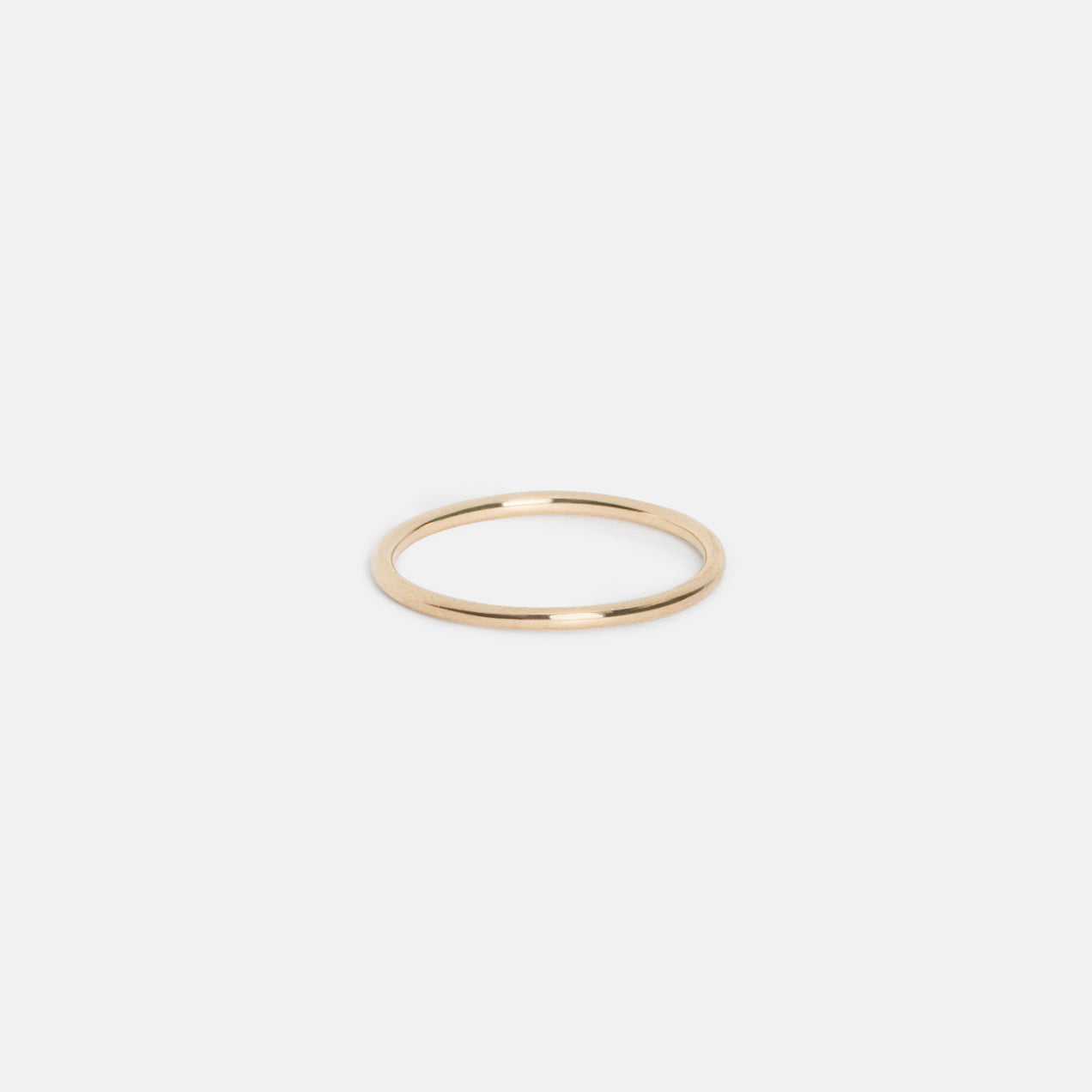 14k yellow gold slim wedding band showing smooth rounded back