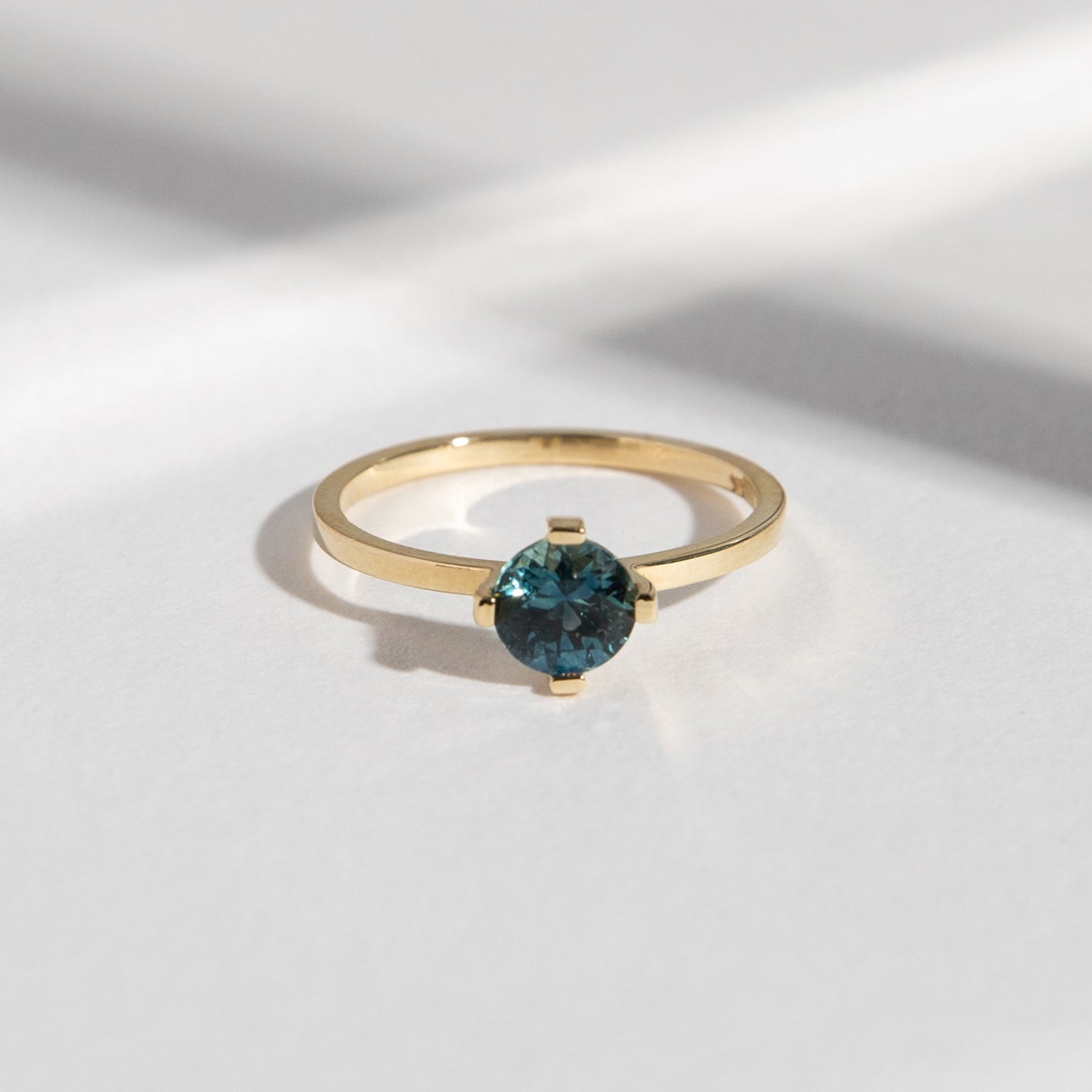 Ema Cool Ring in 14k Gold set with a 0.8ct medium round brilliant cut denim color sapphire By SHW Fine Jewelry NYC