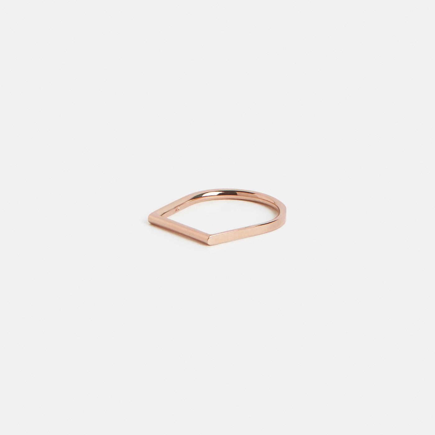 14k rose gold thin wedding band with sculptural shape