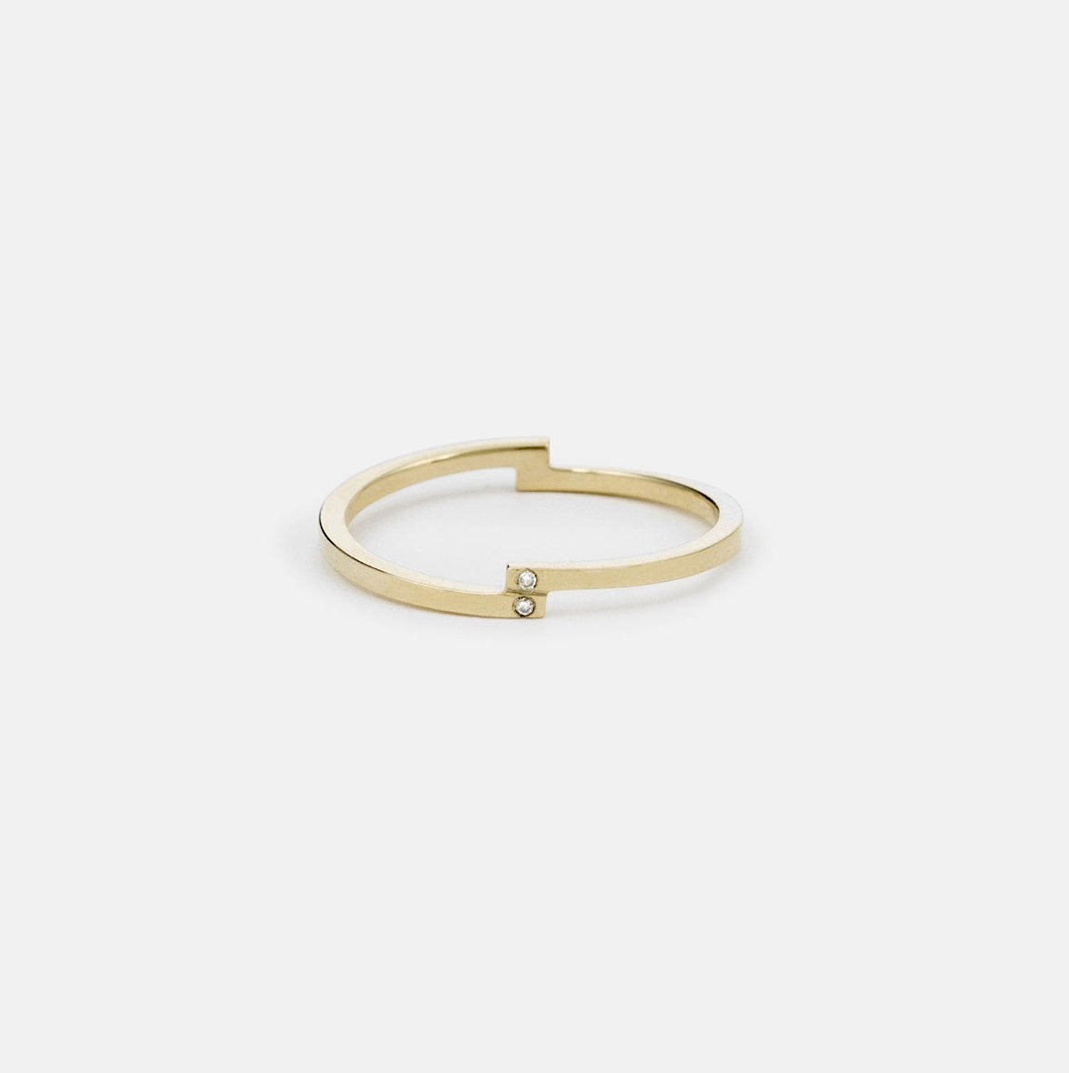 14k yellow gold thin wedding band with four vertically set round diamonds