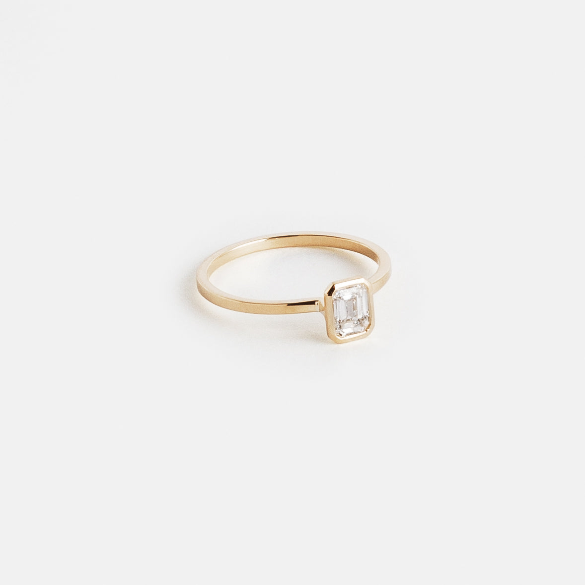 Auda Cool Ring in 14k Gold set with an emerald cut natural diamond By SHW Fine Jewelry NYC