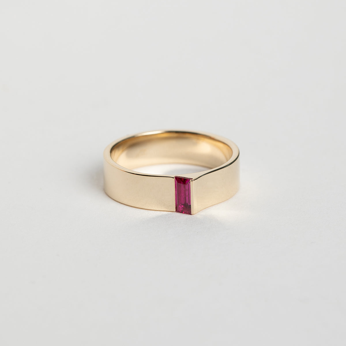 Designer Braga Ring in 14 karat yellow gold set with a baguette cut precious ruby gemstone by SHW Fine Jewelry made in NYC