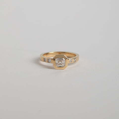 Minimal Velta Ring in 14 Karat Yellow Gold with F-G Color VVS2-VS2 Clarity Lab-Grown Square Emerald Cut Diamond and princess cut diamonds made in NYC by SHW fine Jewelry