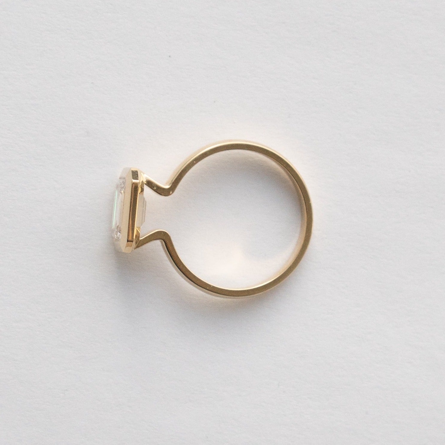 Minimalist Engagement Ring with 1.0ct lab-grown east west emerald cut diamond in 14 karat yellow gold by SHW fine jewelry store in NYC