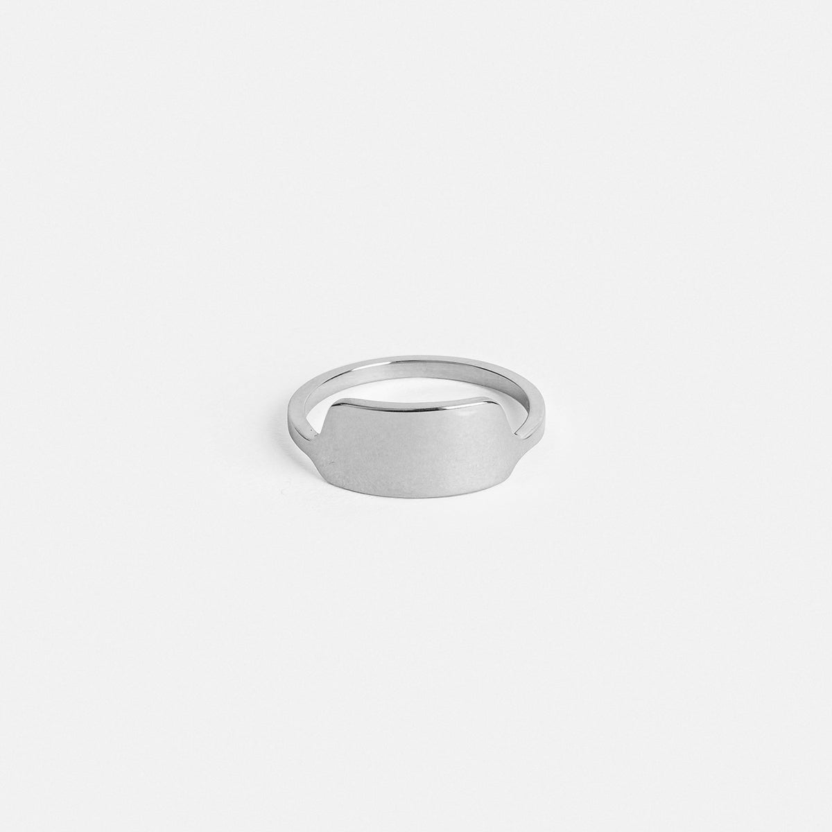 14k white gold sculptural wedding band with shield front