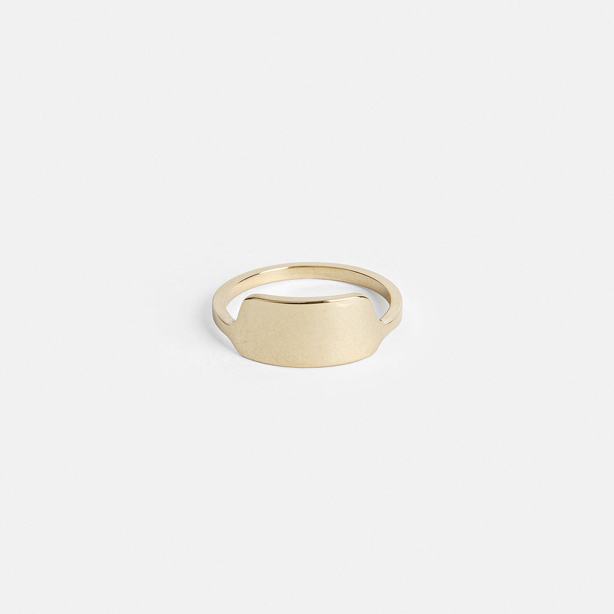 14k yellow gold wedding band with shield-shaped front detail