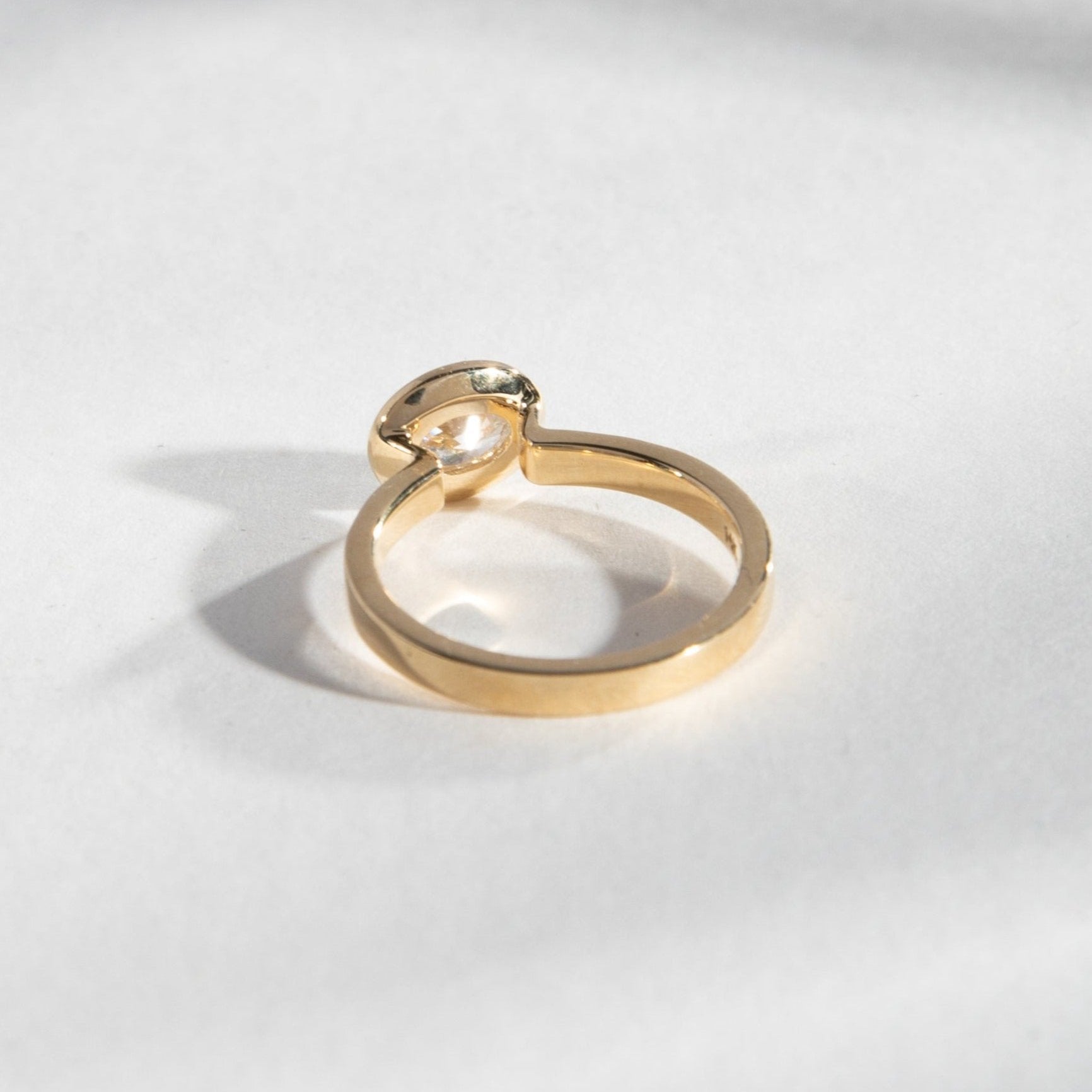 Unusual Bezel Setting Engagement Ring with East West Oval lab grown  diamond in 14 karat gold by SHW fine jewelry stores in NYC closeby